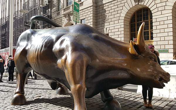 The Story Behind Lower Manhattan’s Charging Bull and Fearless Girl Statues